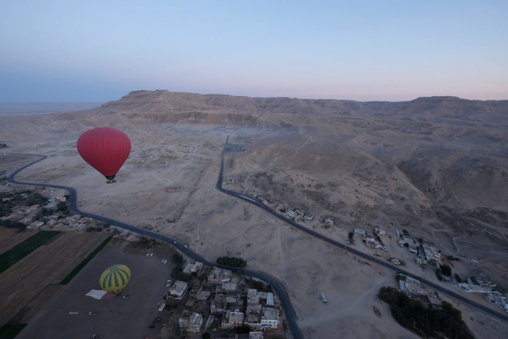 Hot Air Balloon ride at dawn. West Bank, Luxor. View of Hatshepsut's Mortuary Temple. Photo: Genevieve Hathaway Photography.