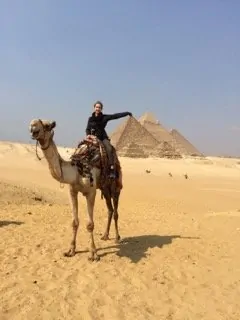 Enjoying the Pyramids by camel. Photo: Joanie Maro.