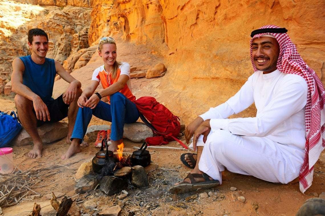 Couple tea with local bedouin