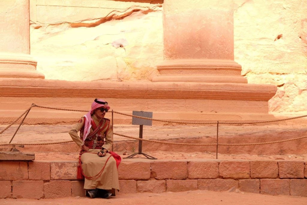 Guard in Petra wearing the traditional Jordanian garb. Even the security adds to the atmosphere. Photo: Genevieve Hathaway Photography.
