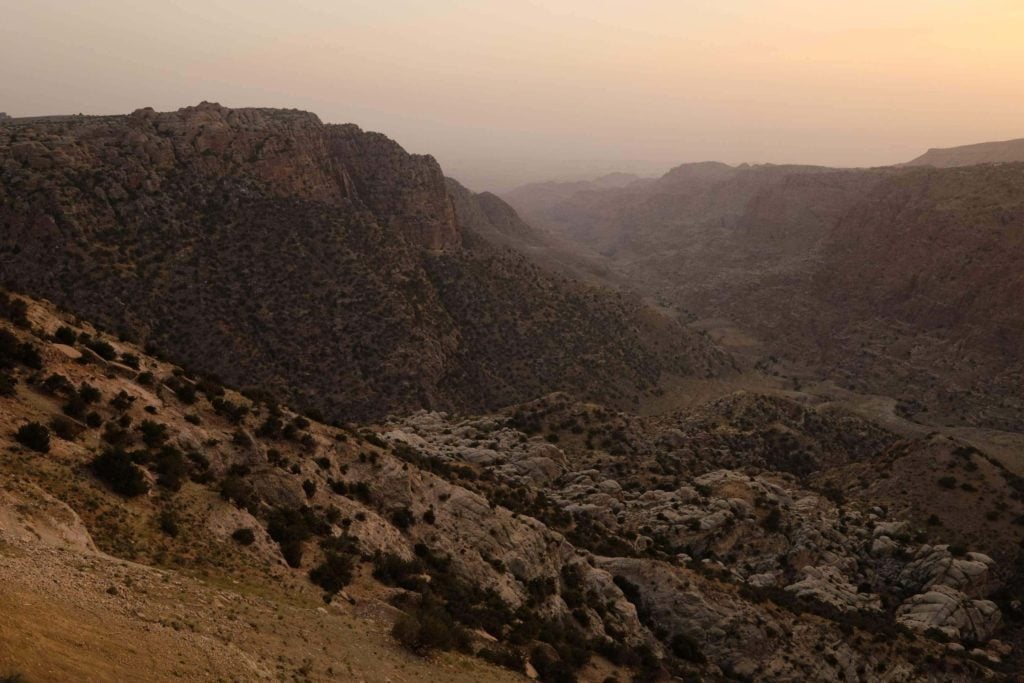 Sunset over the Dana Biosphere Reserve, one of Jordan's top hiking areas and nature reserves. Photo: Genevieve Hathaway Photography.